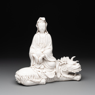 A Chinese Dehua blanc de Chine Guanyin seated on a Buddhist lion, 20th C.