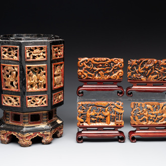 A Chinese octagonal gilt-lacquered wooden stand and four wooden carvings on stands, 19th C.