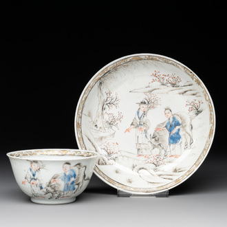 A Chinese blue-enamelled gilt-decorated grisaille cup and saucer, Yongzheng