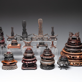 A collection of 55 Chinese wooden stands, 19/20th C.