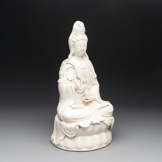 A Chinese Dehua blanc de Chine Guanyin seated on a lotus throne, 20th C.