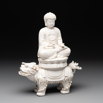 A Chinese Dehua blanc de Chine Buddha seated on a lion, 20th C.