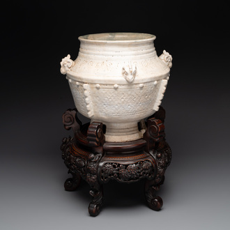 A Chinese archaistic white-glazed vase on wooden stand, Qing