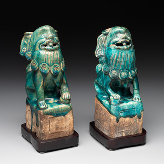 A pair of Chinese turquoise-glazed Buddhist lions on stands, probably Swatow kilns, 19th C.