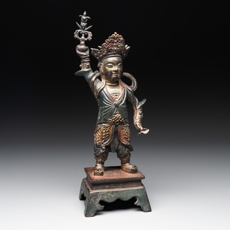 A Chinese gilt-lacquered bronze guardian, Ming