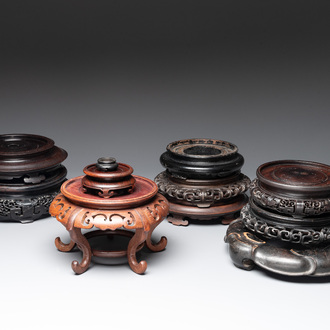 A collection of 11 Chinese wooden stands, 19/20th C.