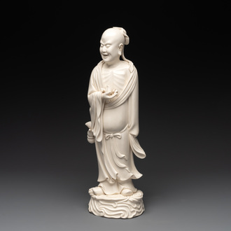 A Chinese Dehua blanc de Chine figure of a sage holding a peach, 20th C.