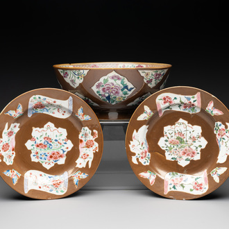 A Chinese famille rose capucin-brown-ground bowl and two plates, Qianlong