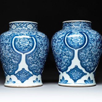 A pair of Chinese blue and white 'peony scroll' vases, Kangxi