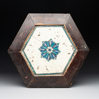 A hexagonal tile with stylised floral design, Damascus, 17th C.