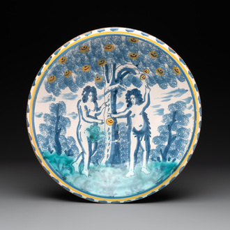 A polychrome English Delftware 'Adam and Eve' blue dash border dish, 17th C.