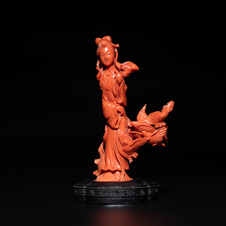 A Chinese red coral sculpture of a lady accompanied by four doves on wooden stand, 19/20th C.