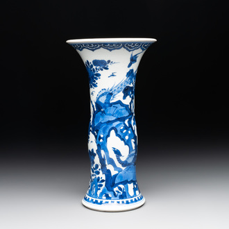 A Chinese blue and white 'gu' vase with birds amongst flowering branches, Kangxi