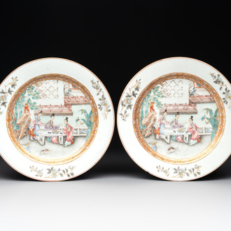 A fine pair of Chinese Canton famille rose 'ladies in the garden' plates, Yongzheng/Qianlong
