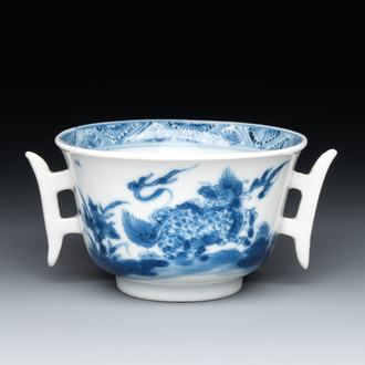 A rare Chinese blue and white 'qilin and phoenix' cup with handles, Kangxi