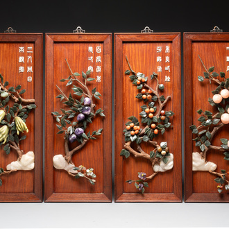 A set of four Chinese wooden panels with precious stones, 20th C.