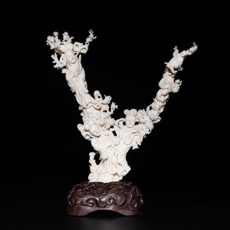 A Chinese white coral group of goddesses on wooden stand, 19/20th C.