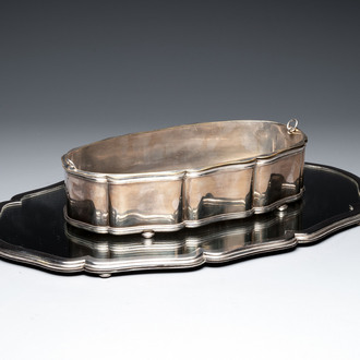A large silver jardinière on a mirror stand, Raymond Ruys, Antwerp, 1920-1930