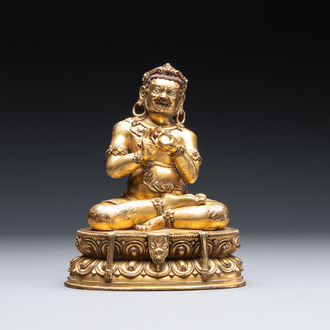 A Sino-Tibetan gilt bronze Virūpa, 19th C.