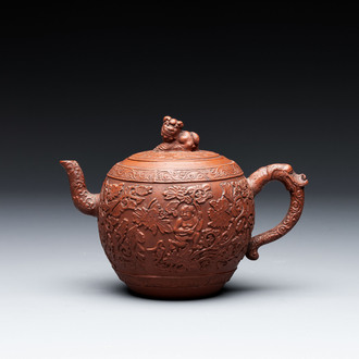 A Chinese Yixing stoneware teapot with boys among flower scrolls, Kangxi