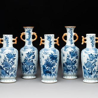 A Chinese blue and white garniture with five vases, Kangxi
