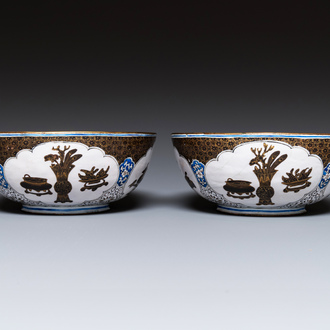 A pair of Chinese Canton enamel 'antiquities' bowls, Yongzheng/Qianlong
