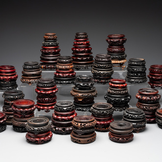 A large collection of 87 Chinese wooden stands, 19/20th C.