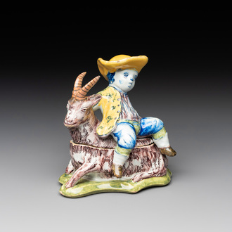 A polychrome Dutch Delft butter tub and cover in the shape of a buckrider, 18th C.