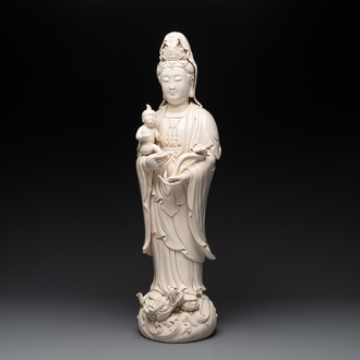 A large Chinese Dehua blanc de Chine group of a Bodhisattva with child, 20th C.