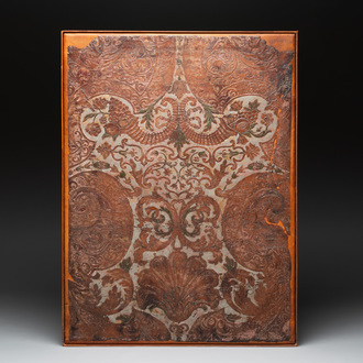 A gold leather fragment with floral design mounted on a wooden panel, Mechelen, 18th C.