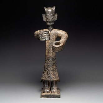 A large Chinese Sanxingdui-style marble sculpture of a standing figure, 20th C.