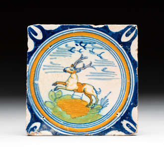 A polychrome Dutch Delft maiolica 'stag' ​​medallion tile, late 16th C.