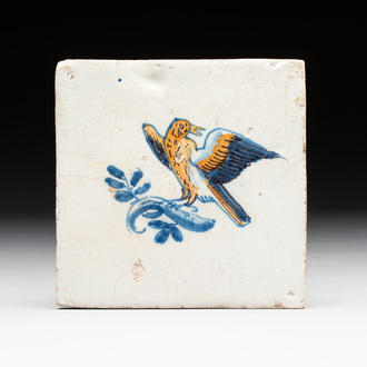 A polychrome Dutch Delft 'bird on a branch' tile, 17th C.