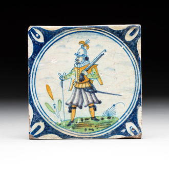 A polychrome Dutch Delft maiolica 'soldier' medallion tile, late 16th C.