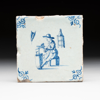 A blue and white Dutch Delft 'coppersmith' tile, 17th C.