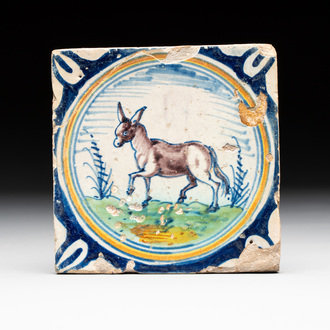 A polychrome Dutch Delft maiolica 'donkey' medallion tile, late 16th C.