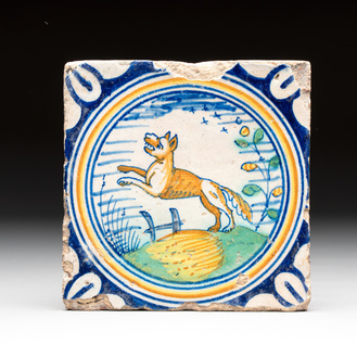 A polychrome Dutch Delft maiolica 'fox' medallion tile, late 16th C.
