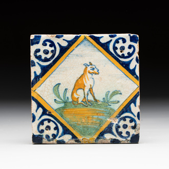 A small polychrome Dutch Delft maiolica 'dog' tile, late 16th C.