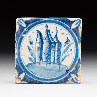 A small blue and white Dutch Delft 'castle' medallion tile, late 16th C.