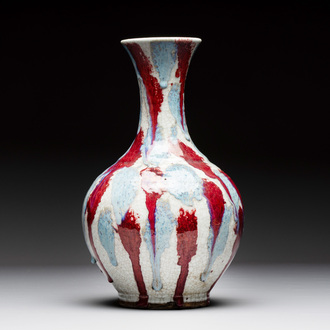 A Chinese flambé-glazed ge-type-ground bottle vase, 19th C.