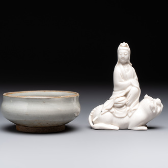 A Chinese 'jun' bowl and a Dehua blanc de Chine group with Guanyin, Ming/Qing