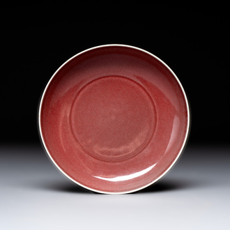 A Chinese copper-red glazed plate, Kangxi mark, 19/20th C.