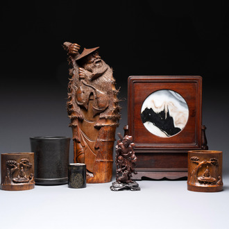 A varied collection of three Chinese brush pots, two sculptures, a lacquered covered box and a marble-inlaid wooden table screen, 20th C.