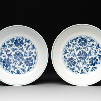 A pair of imperial Chinese blue and white 'lotus scroll' plates, Qianlong mark and of the period