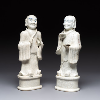 A pair of Chinese blue and white crackle-glazed monks, 19th C.