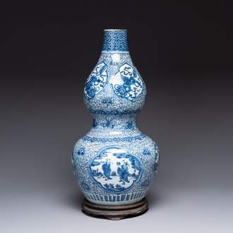 An impressive Chinese blue and white 'Eight Immortals' double gourd vase, Jiajing/Wanli