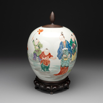 A Chinese famille rose 'ladies and boys' jar with wooden cover and stand, Yongzheng/Qianlong