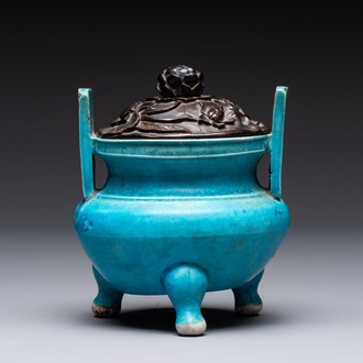 A Chinese turquoise-glazed tripod censer with wooden cover, Ming
