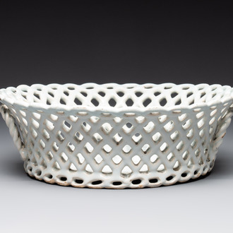 A round white-glazed reticulated pottery basket, Brussels or France, 18th C.