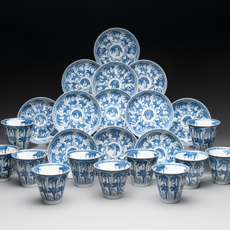 11 Japanese blue and white cups and 12 saucers with floral design, Chenghua mark, Meiji, 19th C.